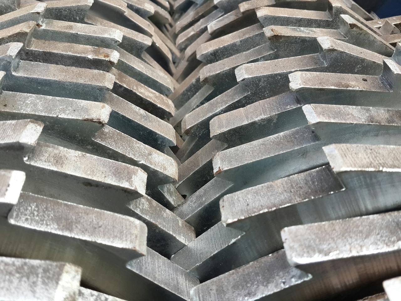 A closeup look of a big barrel shredding and crushing machine