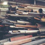 Stack of steel pipes in metal factory shop
